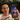 Alex holding a phone with the Be The Bird game