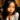 Young woman pouting in a dimly lit lounge room